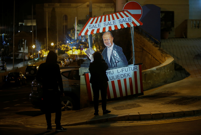 On March 27, 2019, a civic group placed a protest installation at the Freedom Monument in Malta, with a sign reading, "For Sale, For Sale, For Sale: We Are Selling Your Children's Future." This was a critique of Prime Minister Joseph Muscat's sale of Maltese passports, which attracted dubious international investments, regardless of whether they were for transnational money laundering, political corruption, or criminal activities. (Photo by Darrin Zammit Lupi/REUTERS)