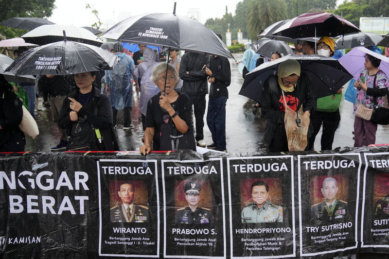 On February 15, 2024, families of victims killed by security forces during the 1998 anti-government protests accused Indonesian military generals of past human rights violations. Among those implicated is Prabowo Subianto (second from the left), who was elected as Indonesia's president in 2024. (Photo by Dita Alangkara/AP Photo)